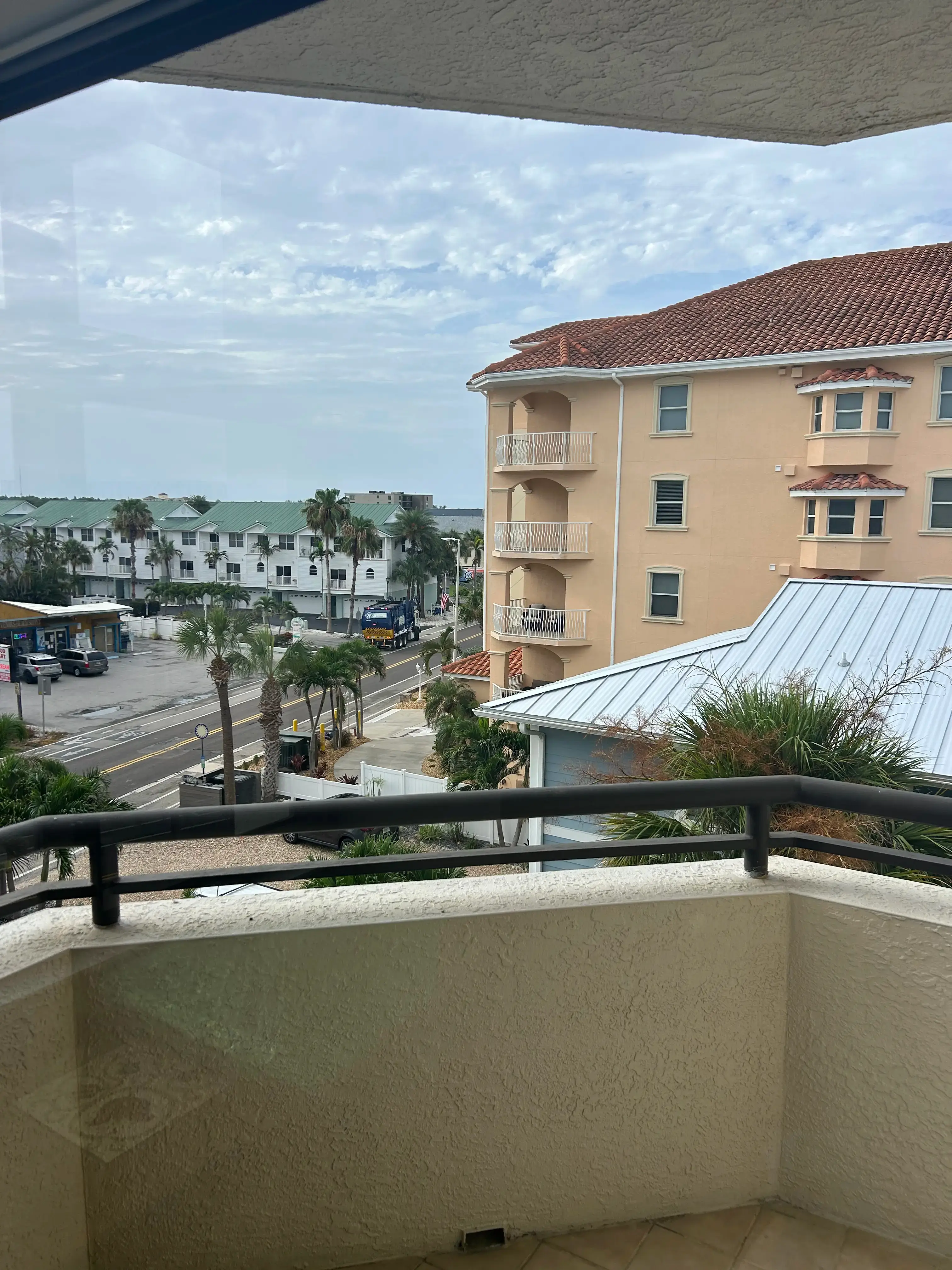 Condo balcony window after cleaning with a clearer coastal view