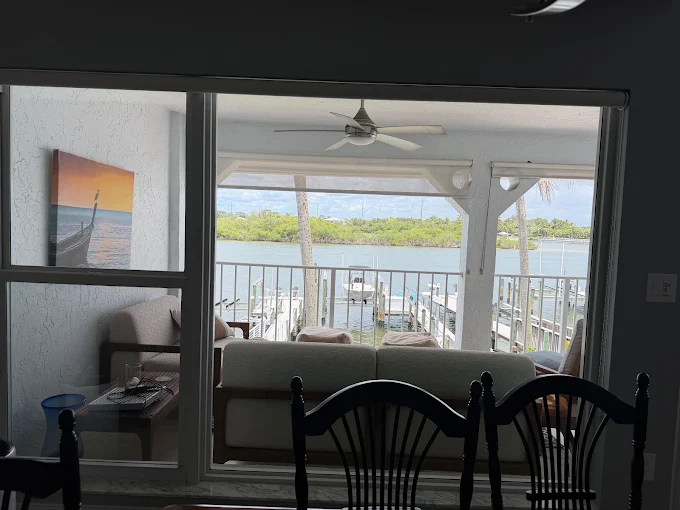 Waterfront condo windows framing a clean marina view